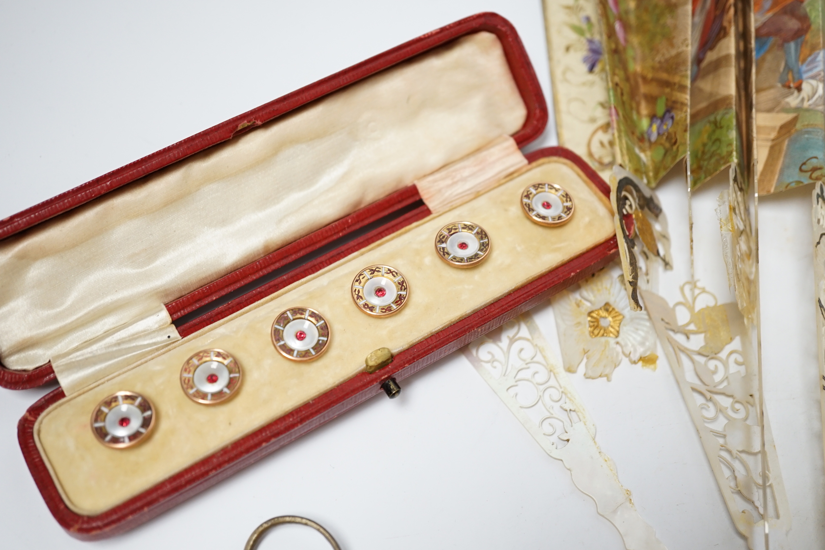 Cased enamel and paste dress studs, a French mother of pearl fan and Lorgnettes